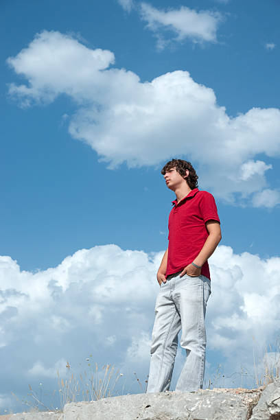 istock teenage men is thinking on the hill 471337721