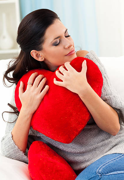 istock Girl with heart shape pillow 471339141