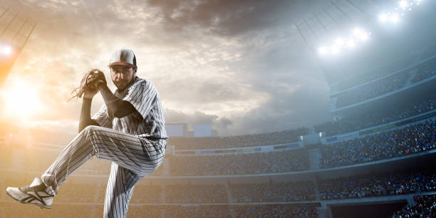 giocatore di baseball colpire un pallone in stadium - sports uniform athlete competitive sport professional sport foto e immagini stock