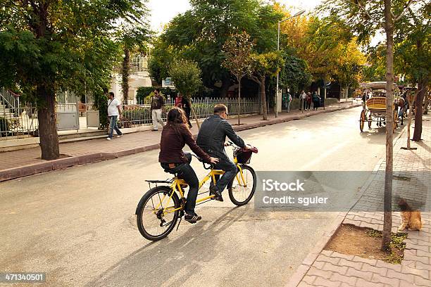 Young Couple Riding Tandem Bicycle Stock Photo - Download Image Now - Couple - Relationship, Tandem Bicycle, Activity