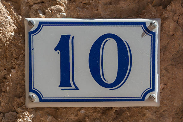 istock Blue and white number 10 ceramic plaque on a house 471340622