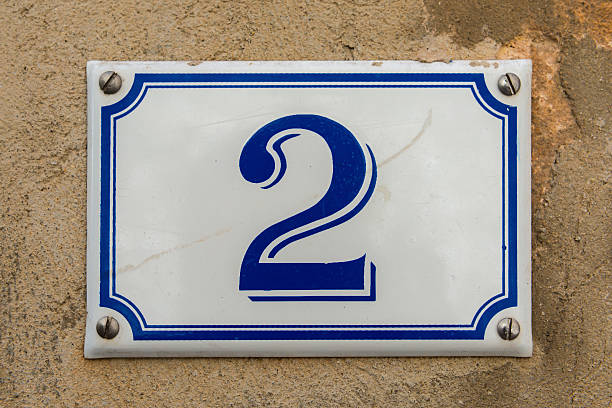 istock Blue and white number 2 ceramic plaque on a house 471340624