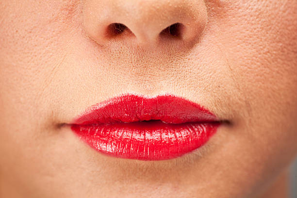 istock Womens lips with bright red lipstick 471341358
