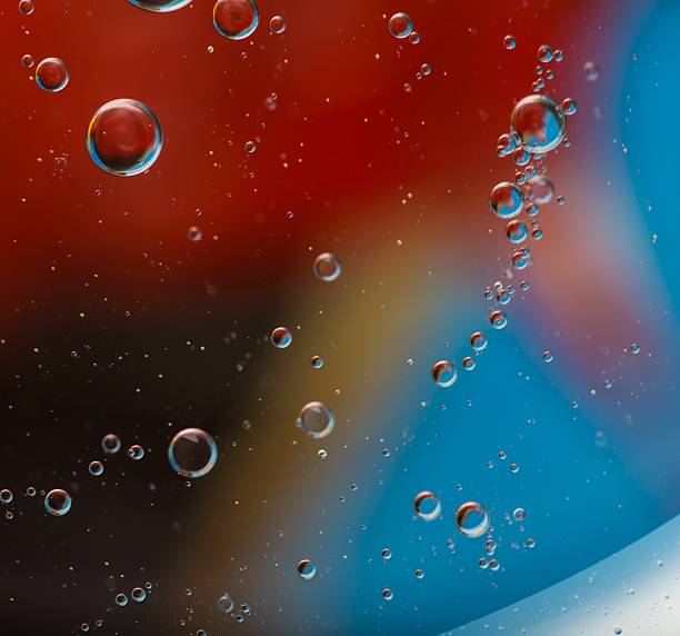 istock Abstraction of oil droplets on water surface 471341376