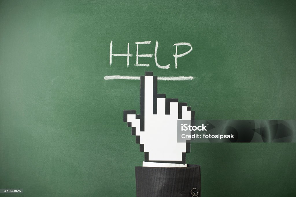 help businessman with dummy cursor hand clicking "help" on the blackboard A Helping Hand Stock Photo