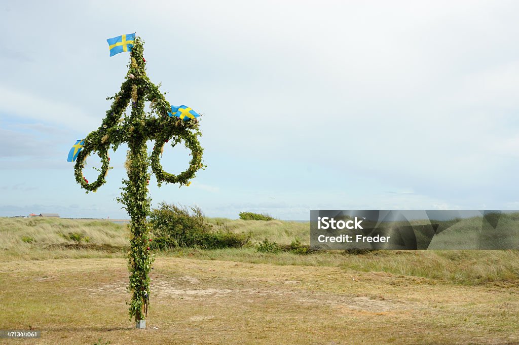 maypole at midsummer festival in sweden a kind of maypole that is called "midsommarstangen" in sweden at the traditional midsummer festival Maypole Stock Photo