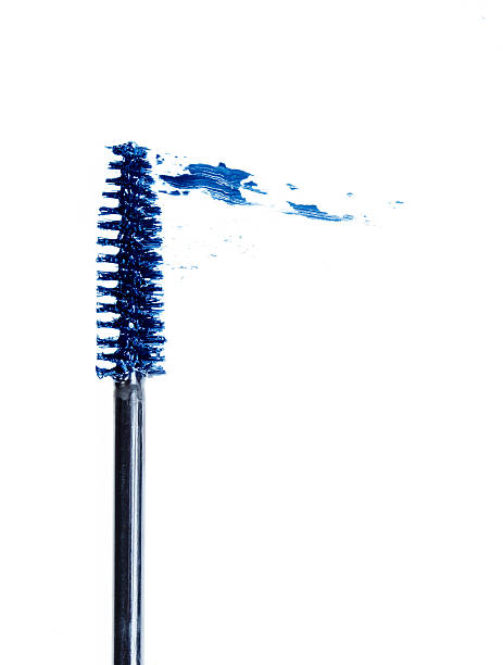 Blue Mascara Blue mascara wand isolated in white with smear mascara wands stock pictures, royalty-free photos & images