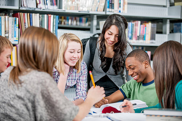 istock Teenagers Working Together on an Assignment 471345664