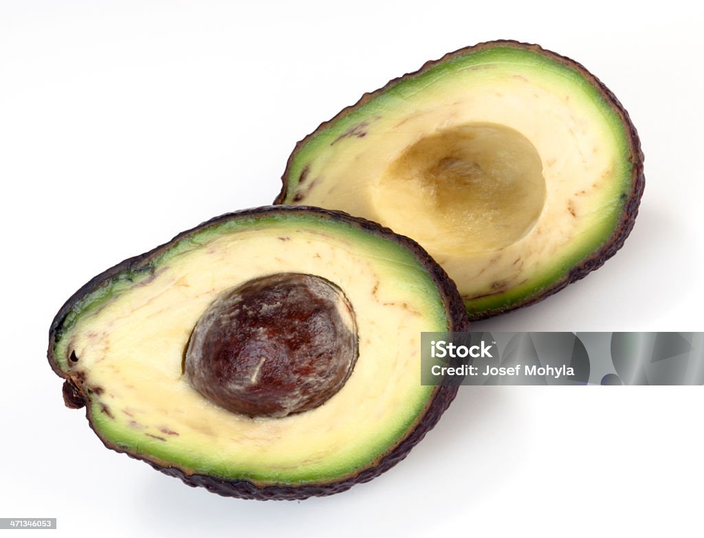 Um die Hälfte geschrumpft Avocado - Lizenzfrei Avocado Stock-Foto