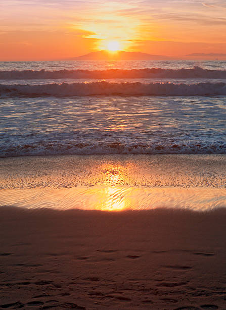 Beautiful sunset on Hollywood Beach with the Channel Islands in the distance.  Near Oxnard, Ventura county, California.  