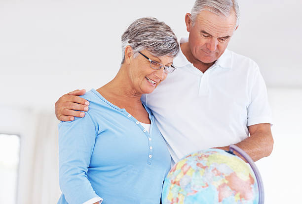 istock Happy couple planning world tour 471346597