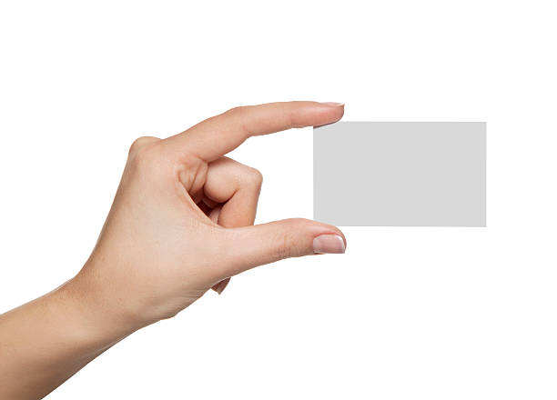 blank card in a female hand stock photo