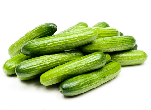 Fresh mini cucumbers isolated on  white background