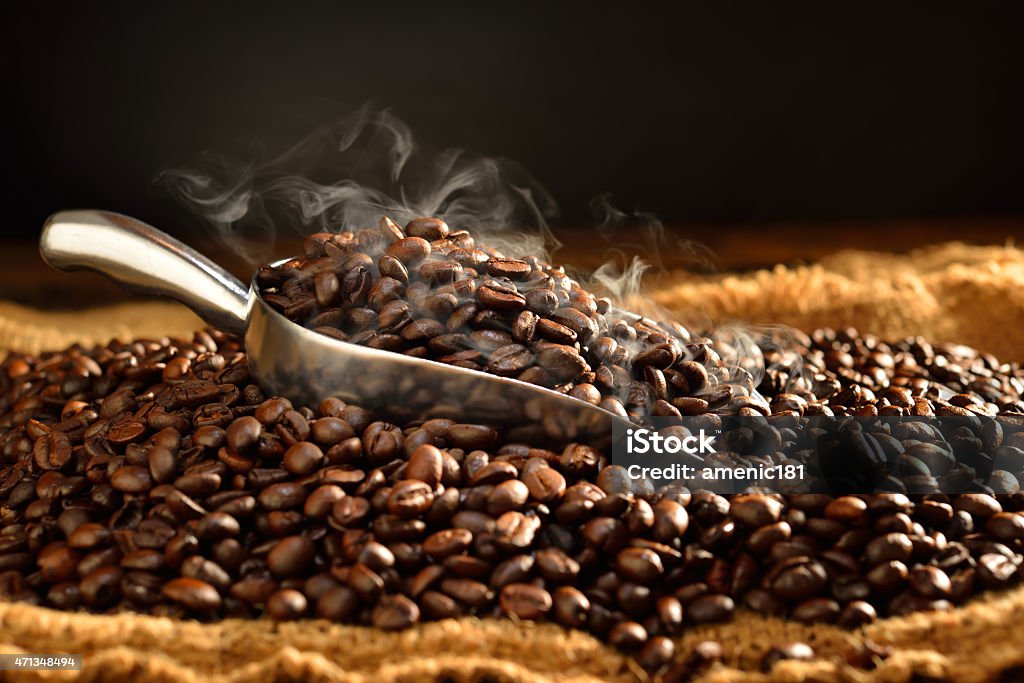 Coffee beans Coffee beans with smoke on burlap,This photo is available without smoke 2015 Stock Photo