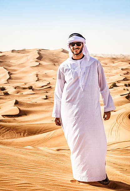 istock arabic man smiling on the desert 471350476