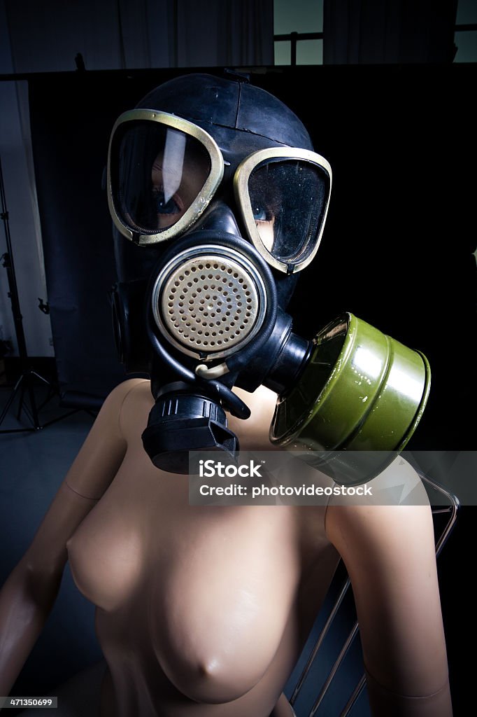 Nude dummy with gas mask Nude dummy with gas mask and almost human eyes. Adult Stock Photo