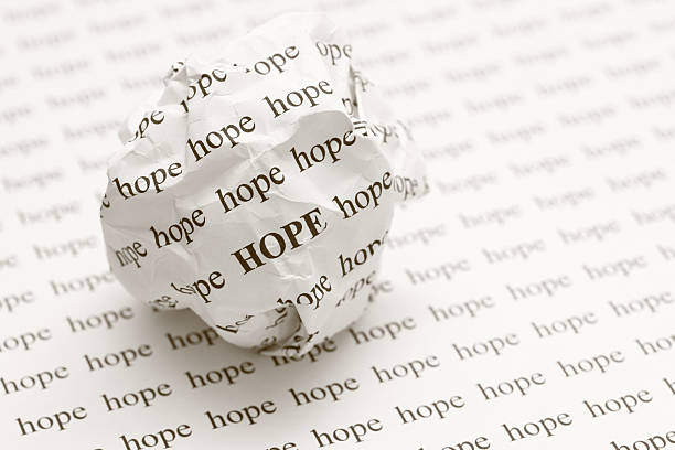 istock Crumpled paper ball with words hope 471351431