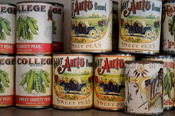Largo, United States - November 9, 2011: Stacked canned vegetables on the shelves of a General Store in Heritage Village from the 1900s with colorful labels featuring College and Hart Auto products. Heritage Village located in Florida recreates the history with relocated buildings staged with products and goods from the early 1900s era.