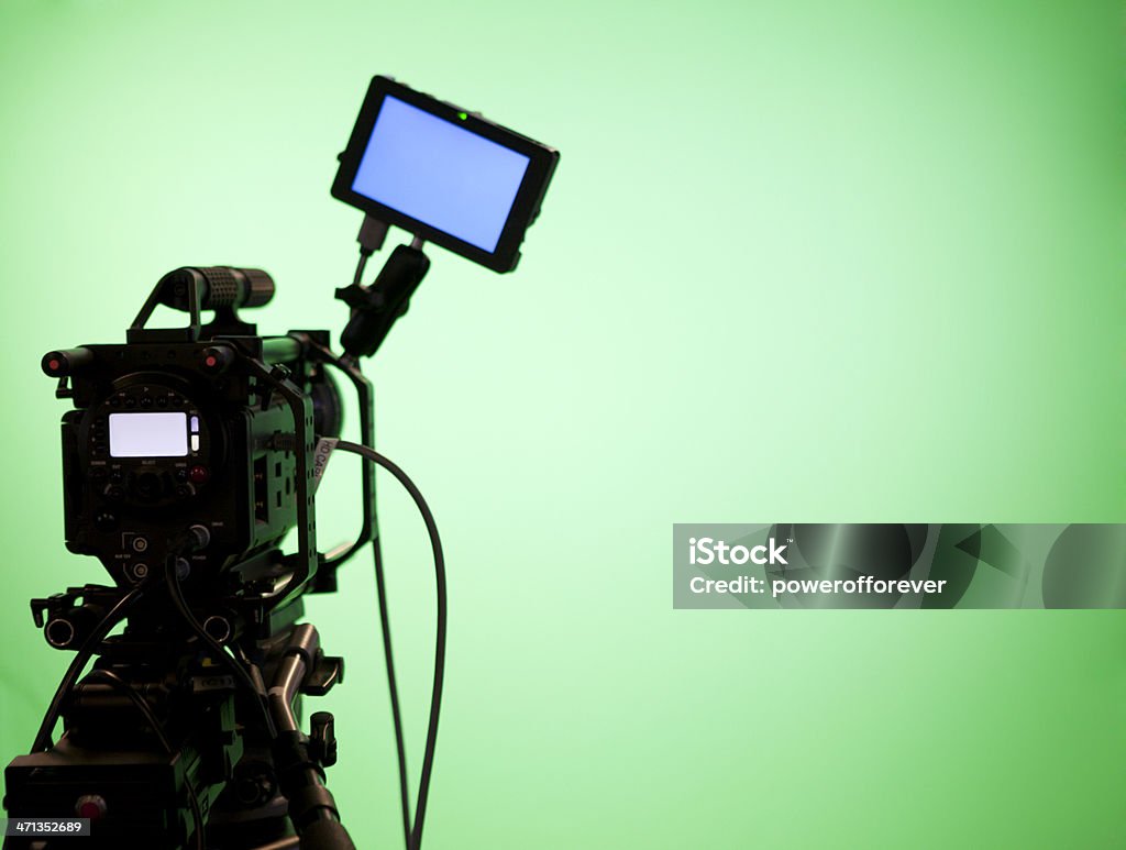 Television Camera on Green Screen Background Television camera on green screen background with video display. Movie Camera Stock Photo