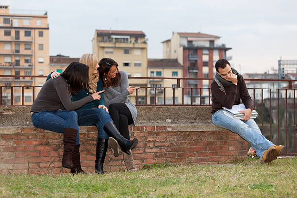 istock Group of Women Laughing at Alone Man 471353183