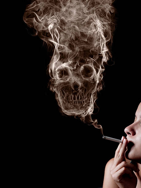 istock The concept "smoking kills". Isolated on a black background 471353821
