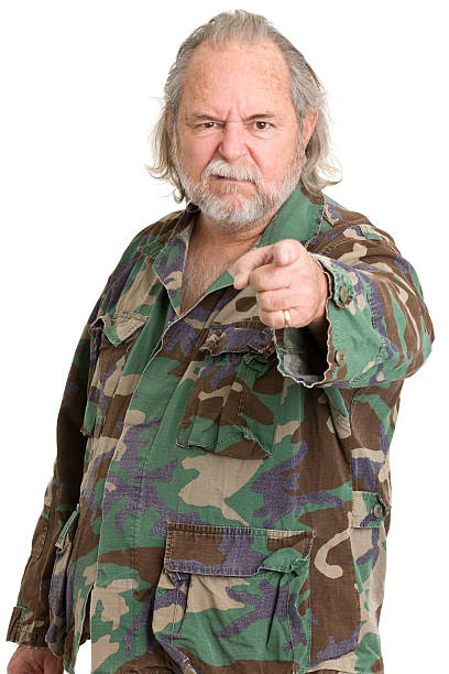 istock Angry Senior Man In Camouflage Points At Camera 471356057