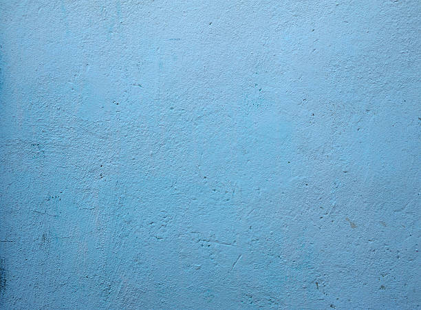 istock Texture of old wall covered with blue stucco 471357270