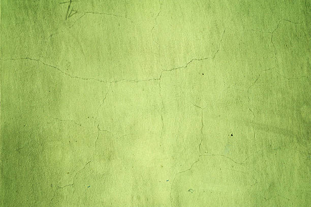 istock Texture of old wall covered with green stucco 471357274