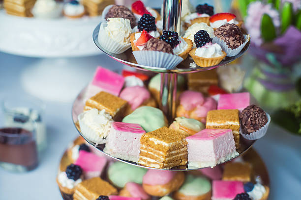 istock Beautiful multicolored decorated baked sweet candy bar cupcake on party 471360558
