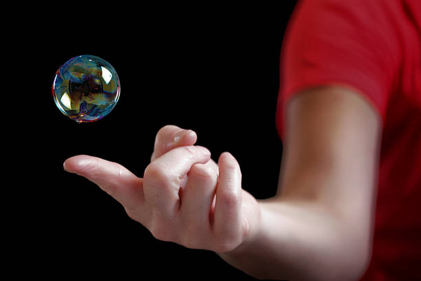 istock Soup bubble suspended above finger 471361417