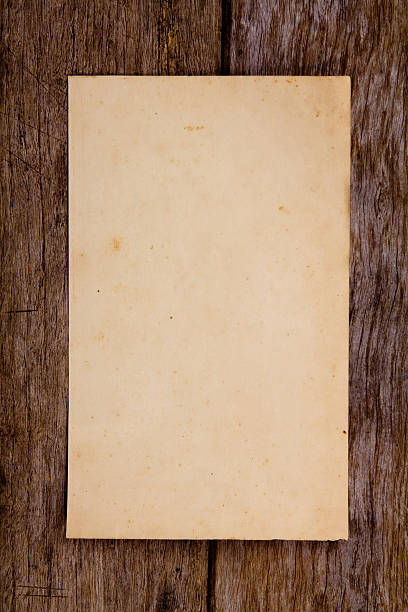 istock Old paper on wooden wall 471362773
