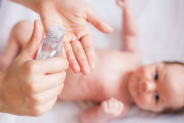 istock Mother makes massage for happy baby 471363460