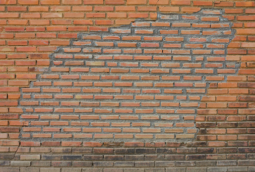 Old brick walls were repaired with new bricks.