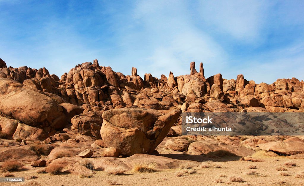 Red rocks Red rocks in the barren sands of the Gobi Desert Dirt Stock Photo