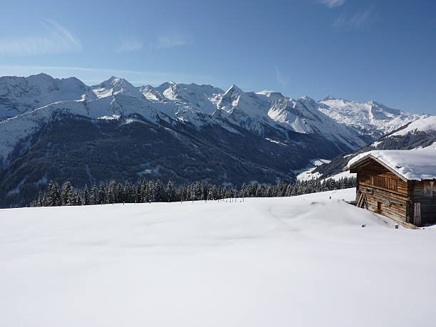 istock Traditional hut in the winter with mountains at background 471366793