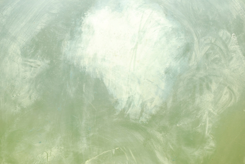 An ethereal background texture in various shades of green. (It's actually a smudged and scratched piece of plexiglass.)