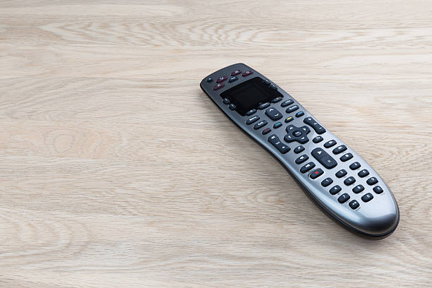 Remote control Remote control on wooden table remote control on table stock pictures, royalty-free photos & images