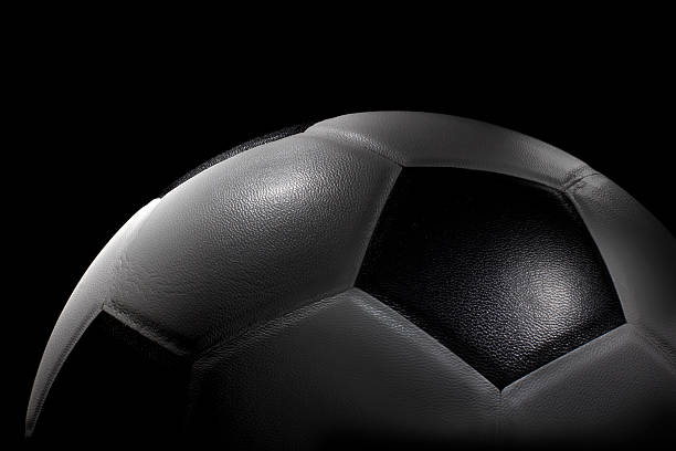 istock Half Planet Soccer ball on black background 471369021
