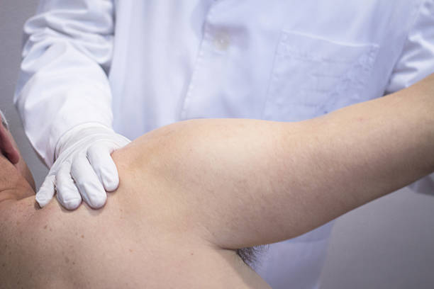 istock Traumatologist orthopedic surgeon doctor examining patient 471369362