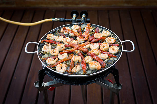 istock Making Black Paella (9 of 10): mixing in the shrimp 471369615