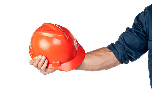 istock Male Service Worker Holding A Hardhat 471369643
