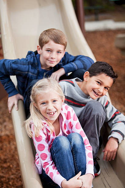 istock Children on playground slide 471370299