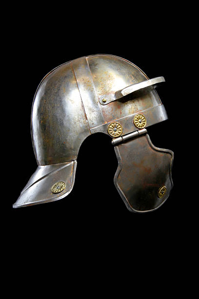 Roman Helmet on Black A Roman helmet on a black background. This is a reconstruction of a Roman "Galea", the helmet of a common roman soldier.  roman army stock pictures, royalty-free photos & images