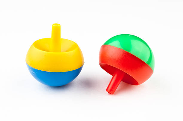 istock toy spinning tops colorful white background fun 471370971