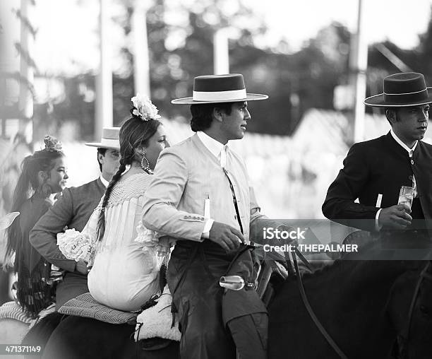 Horse Riders And Women In Flamenco Dress Stock Photo - Download Image Now - Seville, Traveling Carnival, Adult