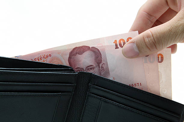 istock concept of pick up money from wallet 471372597