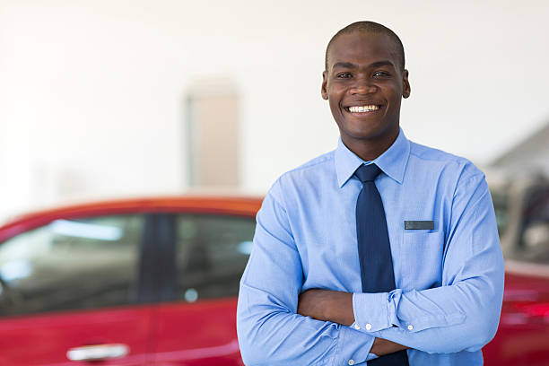 istock african man working at car dealership 471373140