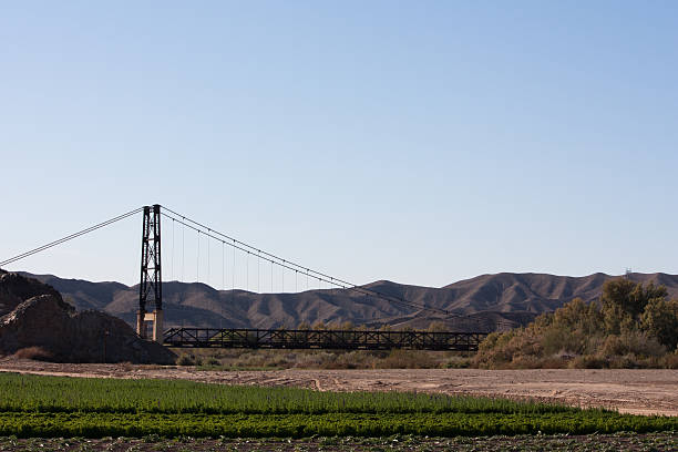 This 800 ft suspension bridge that now spans only desert can be seen from the highway, but is no longer accessible to vehicles. \