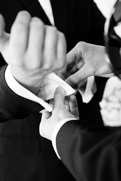 Best Man Helping Groom with Cuff links