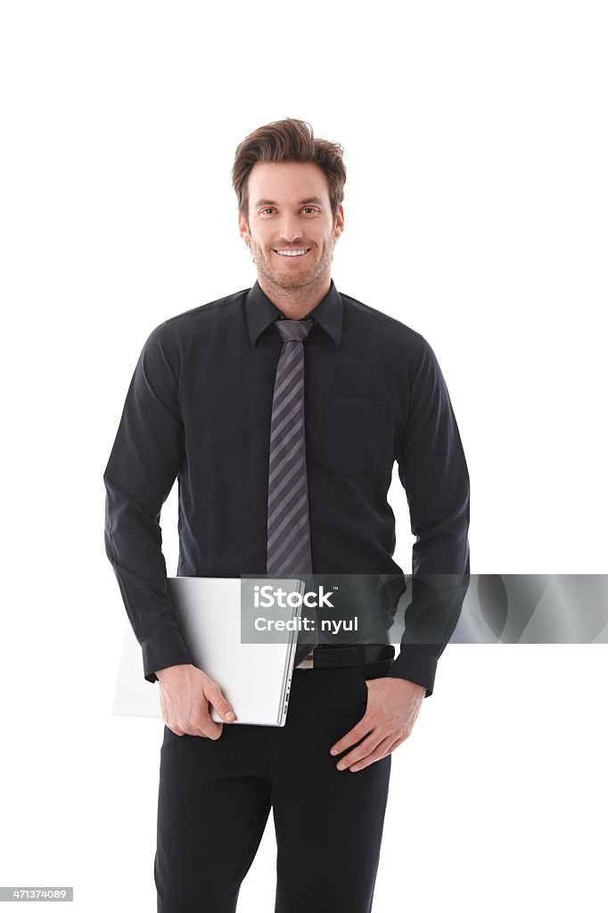 Jovem Empresário segurando computador portátil a sorrir - Royalty-free Homens Foto de stock